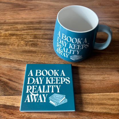 A Book A Day Keeps Reality Away mug